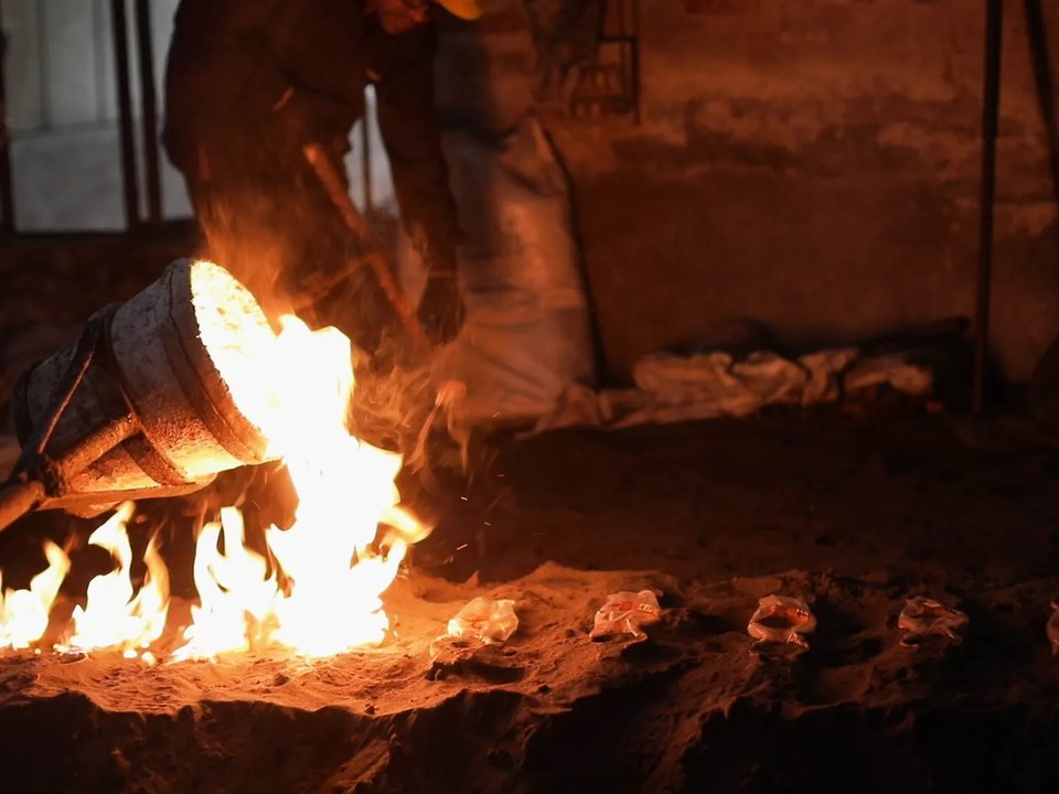 Molten metal poured into shell moulds